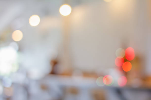 istock Blurred Empty on people. Coffee shop interior design With chairs and white walls. Abstract background 1211649100