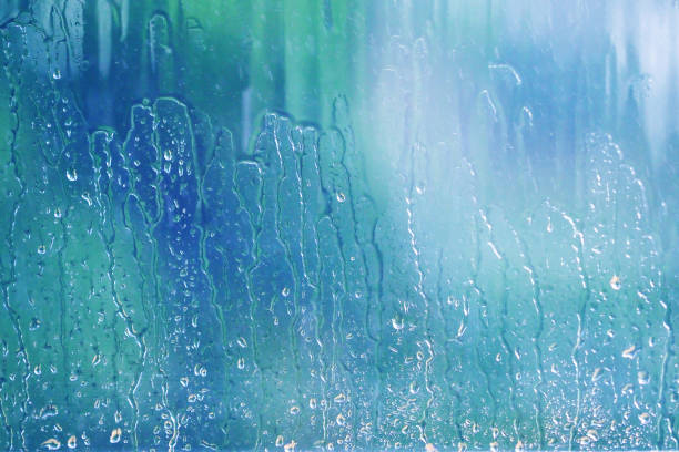Rain, natural water drops on window glass