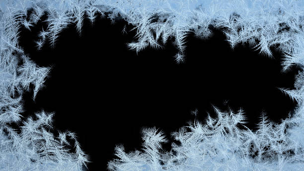 istock Frosted frame from Borders to the Center. Frosted patterns on the glass. 1211651253