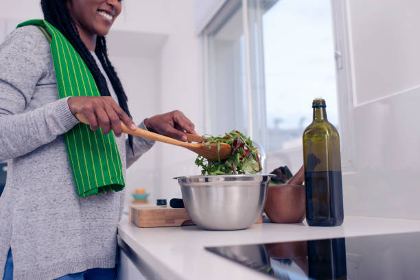 istock Woman preparing fresh salad. 1211653624