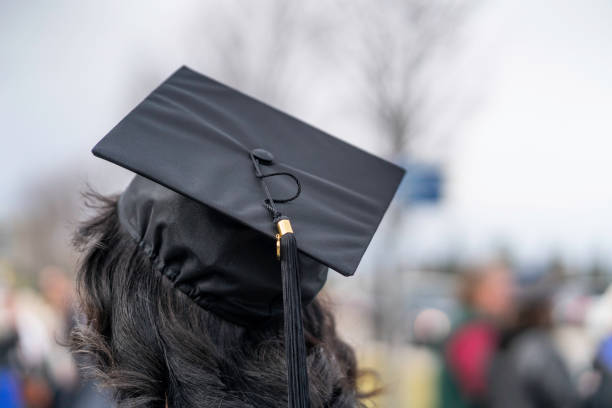 istock African American Nigerian Fresh university graduate wearing university Mortarboard 1211656621