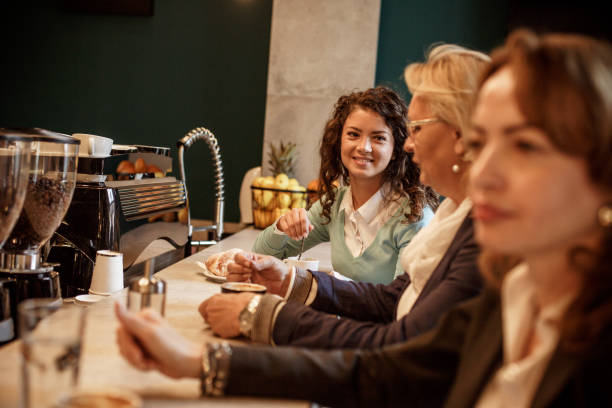 istock Friends hanging out at coffee shop 1211663076