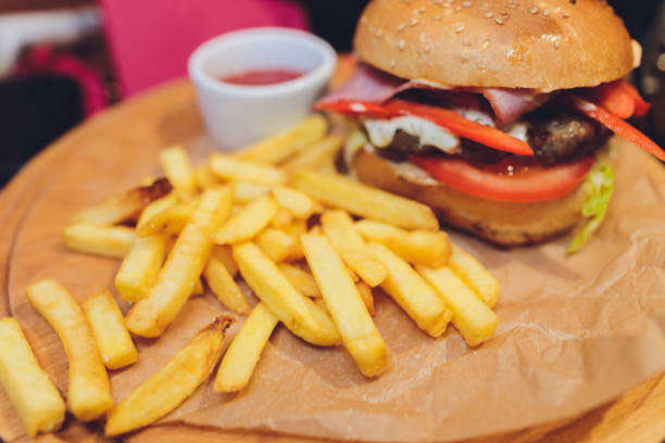 istock Bacon cheese burger with beef patty tomato onion, hamburger menu. 1211663414