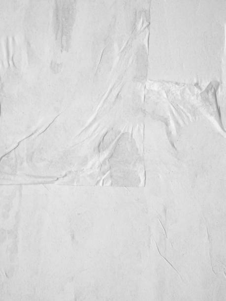 istock Blank white crumpled and creased paper poster texture background 1211663570