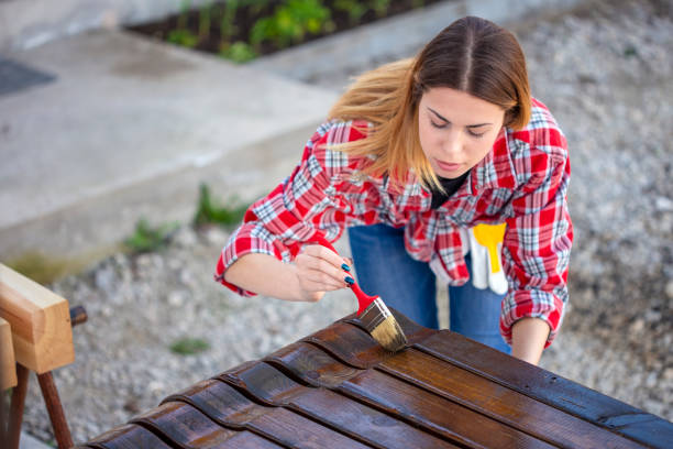 istock Maintaining a house by using wood varnish 1211663799