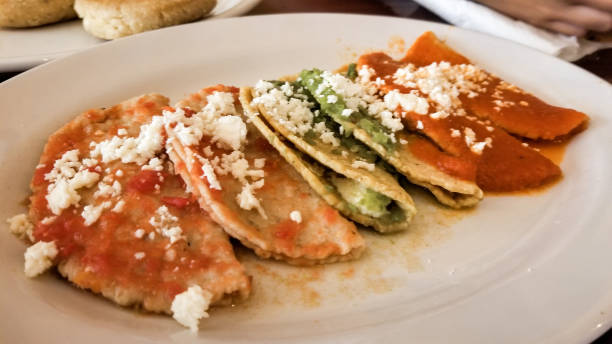 istock Traditional Mexican saucer buffet called Enchiladas Potosinas 1211670378