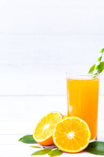 istock Fresh orange juice with slices fruits, isolated on white background, Selective focus, Copy space, Healthy food concept. 1211673517