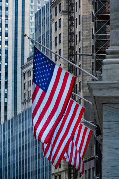istock lose up Manhattan building exterior with American flag 1211675210