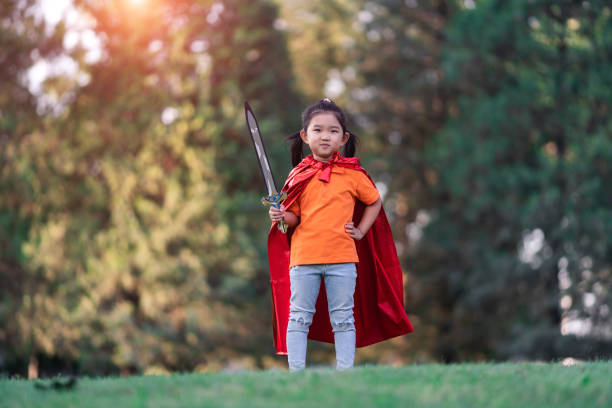 istock Wonder Girl Holding a Sword 1211680848