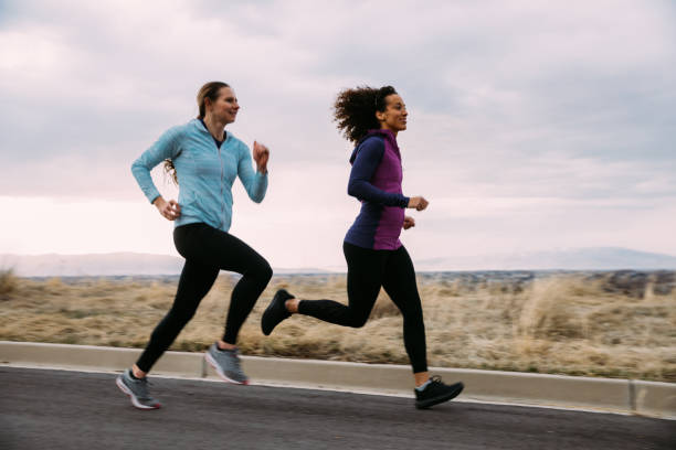 istock Female Running Friends 1211680995