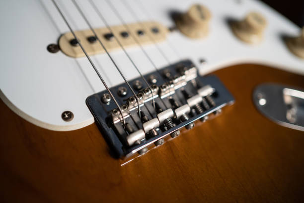 istock Bridge and saddle of electric guitar. 1211682687
