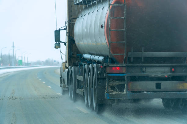 istock Fuel trucks passing on winter road 1211683602
