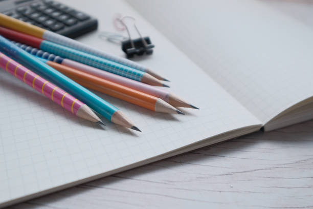 istock Close up of pencils on notepad, back to school 1211689311