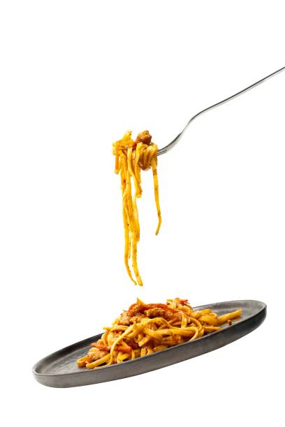 istock Pasta flying with fork and plate. Isolated. 1211691561