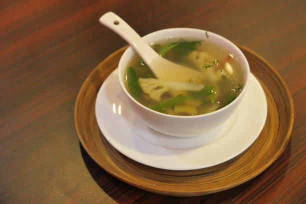 Close up of vegetable soup in a bowl on table.