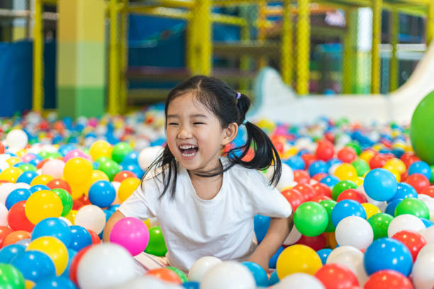 cute girl at the ball pool - ball pool imagens e fotografias de stock