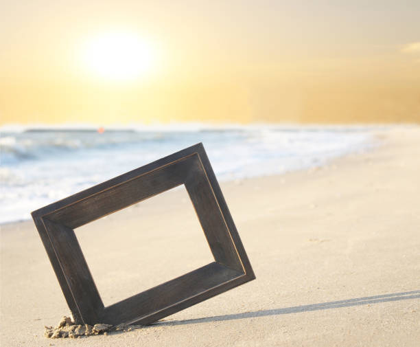istock Photo frame on sand beach for sunset 1211694166