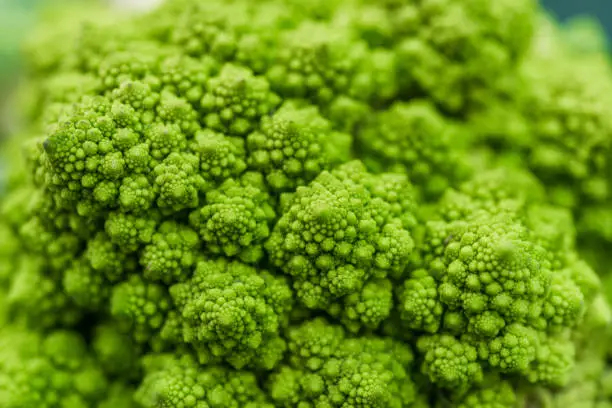 Photo of Macro food photo of organic romanesco broccoli at the farmers market stall