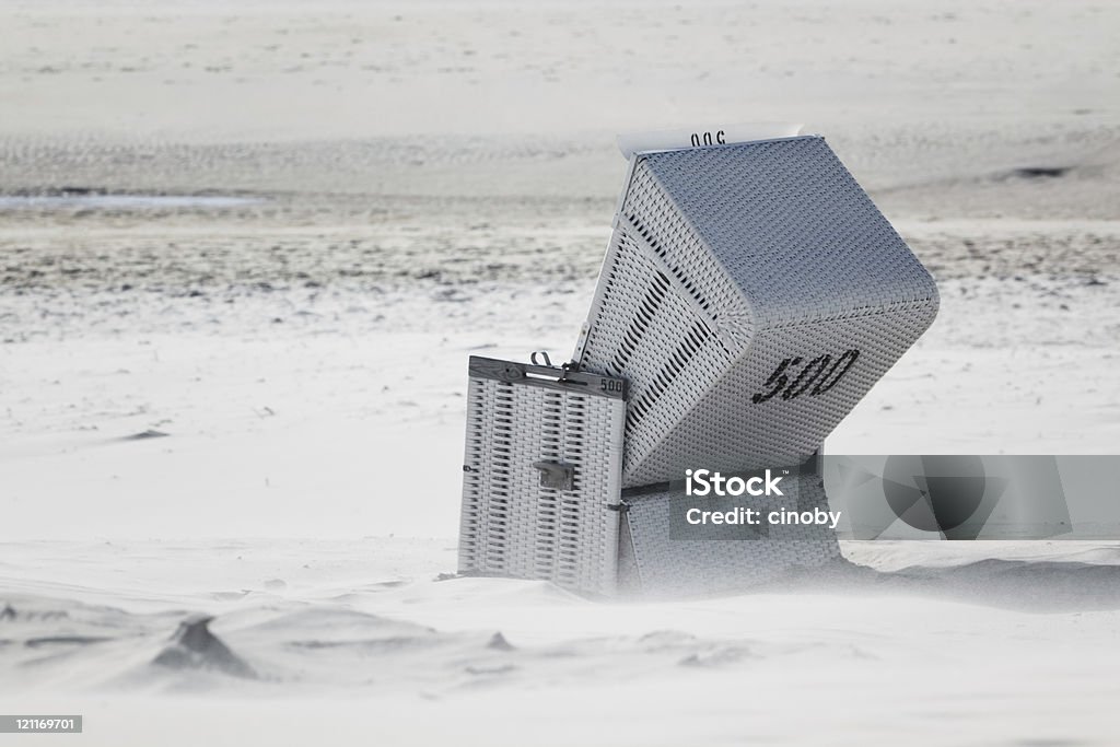 Windy Hooded Beach Chair Hooded Beach Chair in the Storm Abandoned Stock Photo