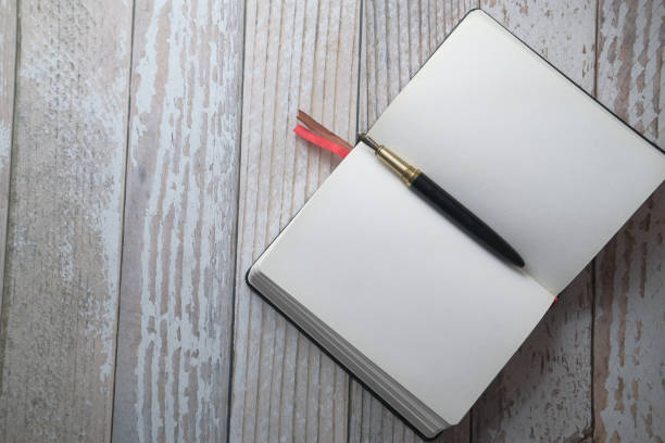 istock top view of fountain pen and open diary on table 1211699333