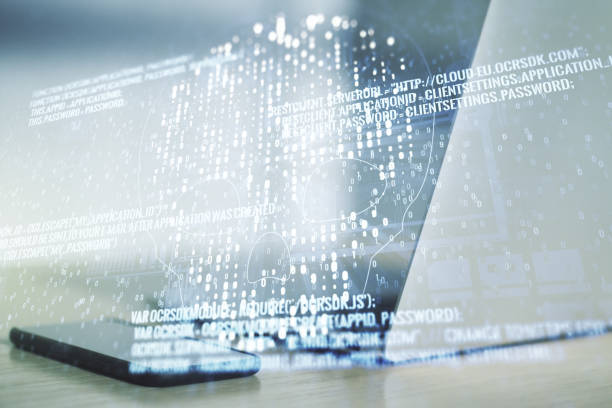 istock Double exposure of creative code skull hologram on laptop background. Malware and cyber crime concept 1211700379
