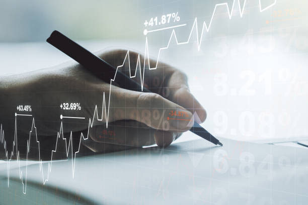 istock Double exposure of abstract creative financial diagram with hand writing in notebook on background, banking and accounting concept 1211700519