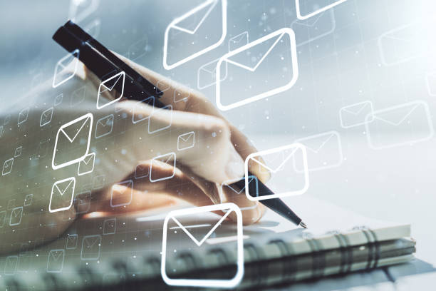istock Creative abstract postal envelopes hologram with hand writing in diary on background, email and notification concept. Multiexposure 1211701440