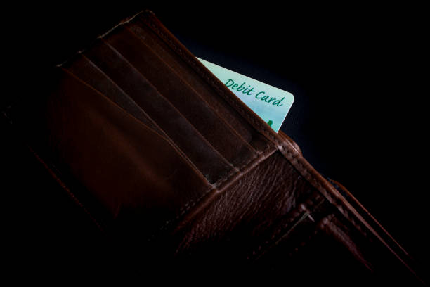 istock debit card in brown wallet 1211702375