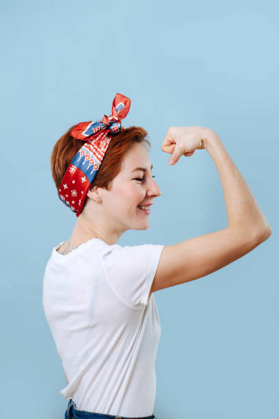 istock Confident housewife showing off strength, tencing biceps 1211706222