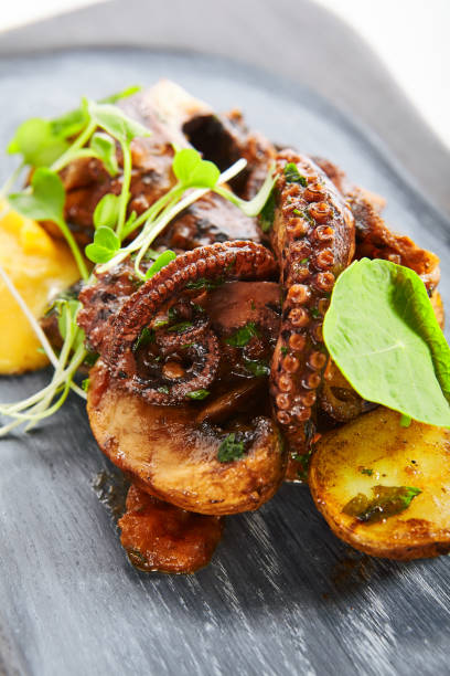 istock Grilled octopus with baked potatoes 1211706438