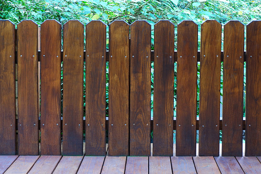 Front View Photo of Wooden Picket Fence in the Garden