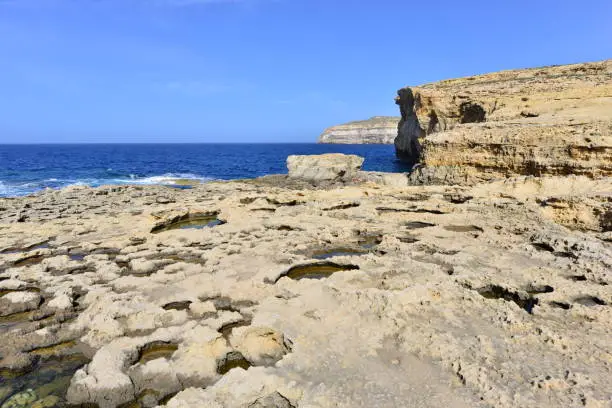 Photo of Dwejra bay and all that is left of the Azure window after a storm in March 2017