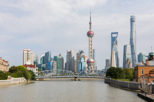 Waibaidu Bridge and skyline of Lujiazui in Shanghai Shanghai, China - October 6, 2019: Waibaidu Bridge and skyline of Lujiazui, Pudong viewed from the Zhapu Road Bridge crossing Suzhou Creek, Shanghai, China. suzhou creek stock pictures, royalty-free photos & images