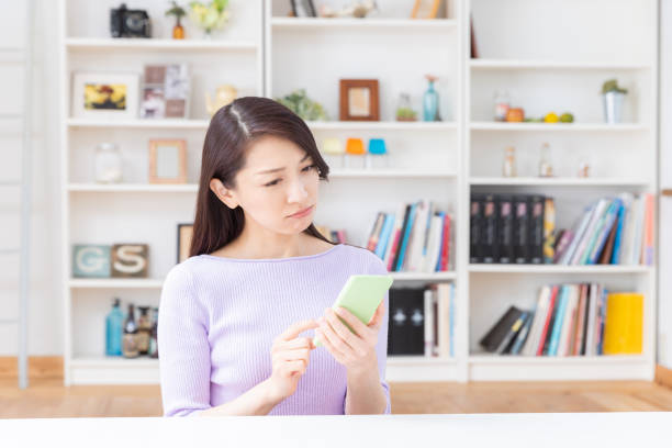 istock asian woman to see a smart phone,think, 1211712707