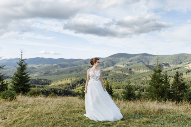 istock Beautiful bride and groom at the mountains 1211714254
