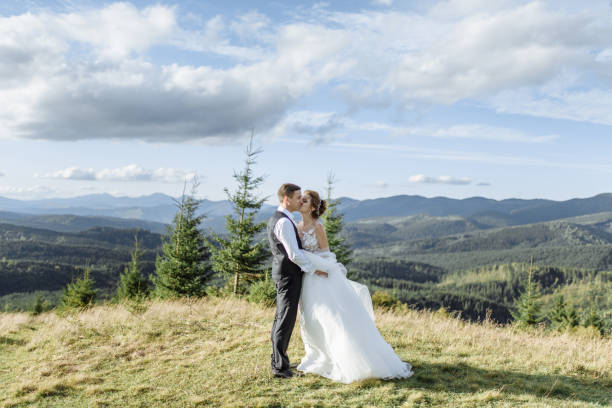 istock Beautiful bride and groom at the mountains 1211714321