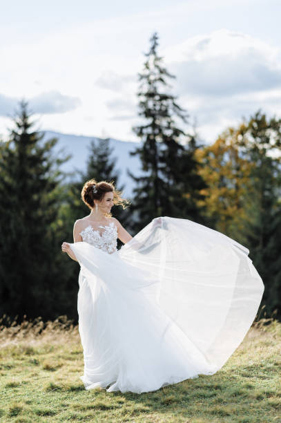 istock Beautiful bride and groom at the mountains 1211714337