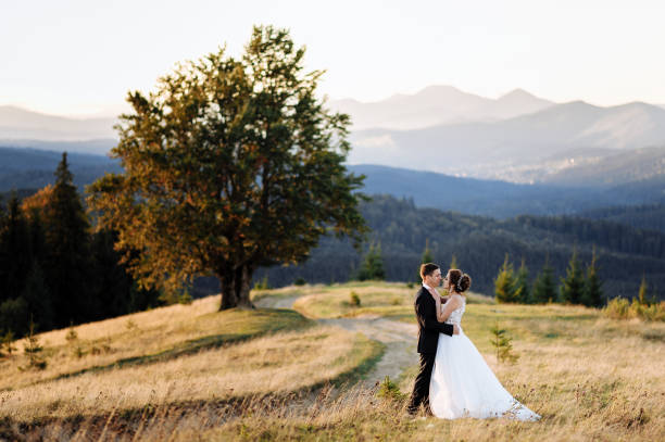 istock Beautiful bride and groom at the mountains 1211714912