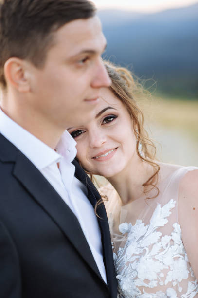 istock Beautiful bride and groom at the mountains 1211714986