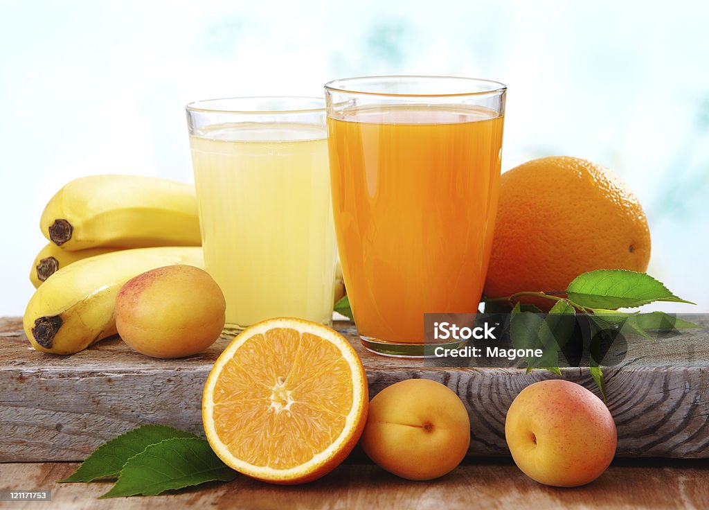 Two glasses of fresh juice and fruits on the table fresh juice Apricot Stock Photo