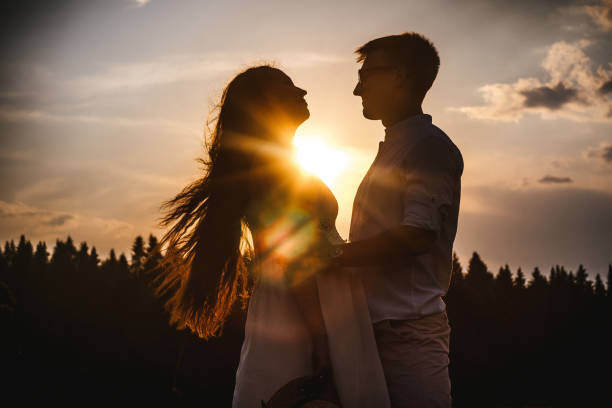 istock Loving couple in the field. Sunset. 1211720489