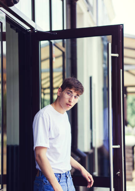 istock Handsome male model wearing white blank t-shirt 1211721942