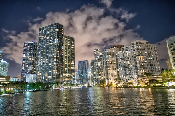 istock Downtown city night skyline with river and buildings 1211727769