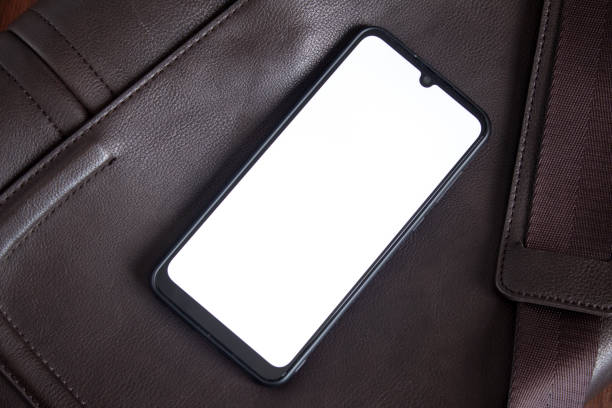 istock The smartphone lies on a leather bag 1211727846