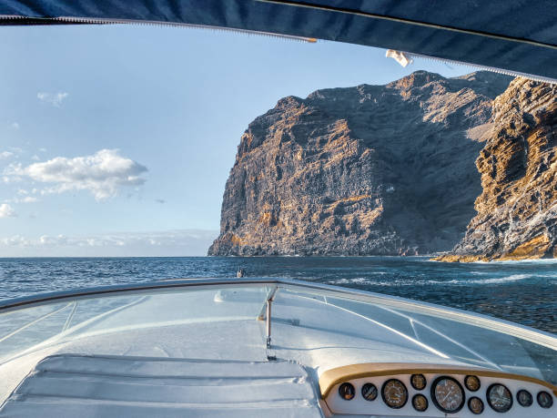 istock Sailing near the rocky coast 1211732809