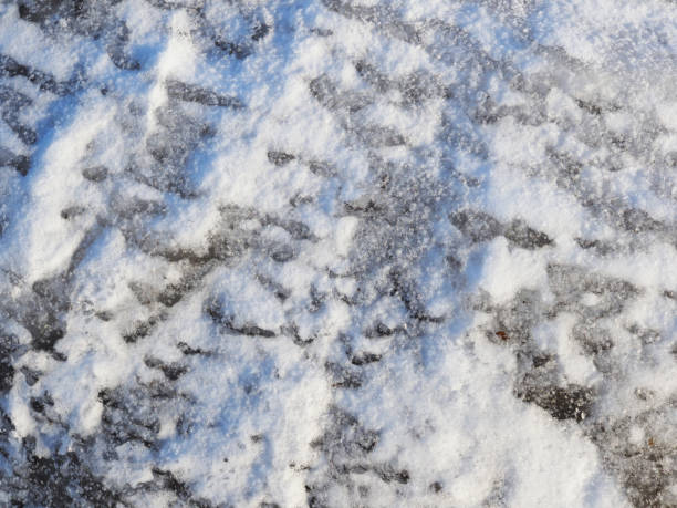 istock White snow and clear ice. Background 1211733977