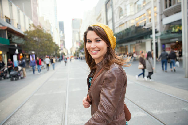 Female Tourist Exploring Downtown Melbourne in Winter