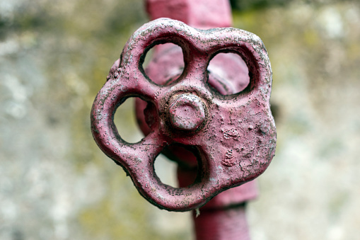 Close-up of red large industrial water tap.
