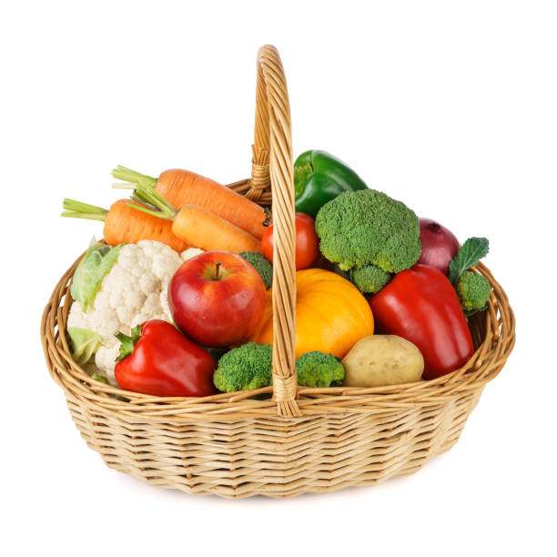 istock Fresh fruits and vegetables in a wicker basket. Isolated. 1211736573