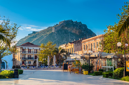 Nafplio-Greece April 12 2017 Philellinon square-The historic square of the city located in the old town.The castle of Palamidi in the background.